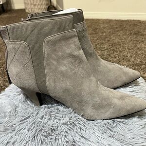 NWOT light gray kitten heel booties with back zipper entryway.